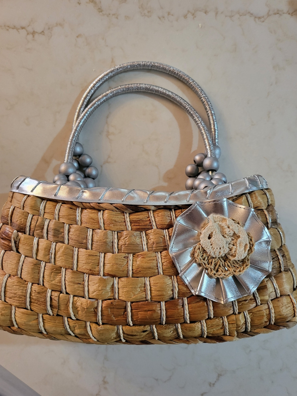 Woven Straw Tote with Silver Trim and Floral Accent